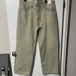 Universal Thread Women’s Mid Rise 90’s Baggy Jeans with yellowish tint